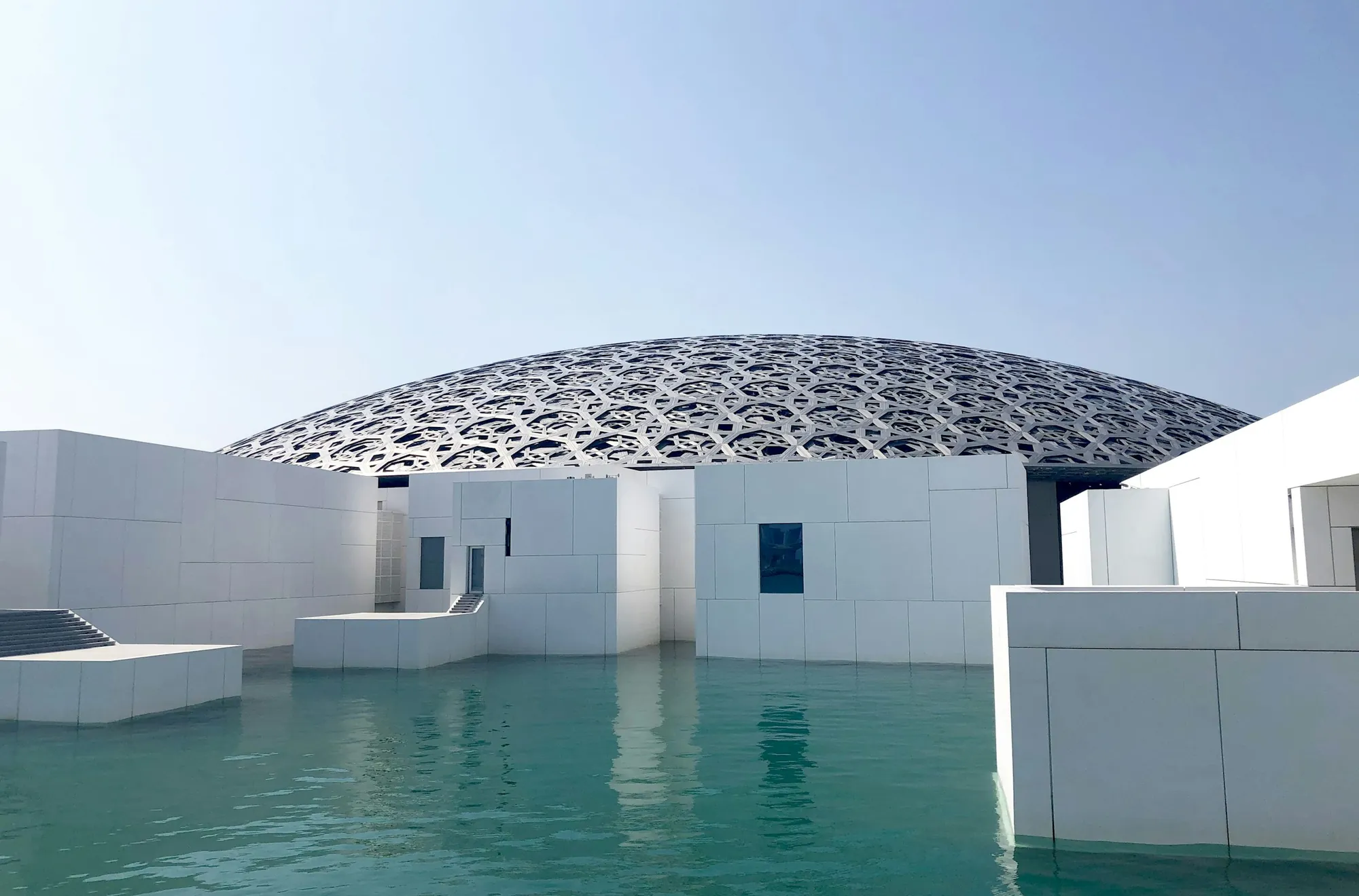 Louvre Abu Dhabi on Saadiyat Island, seen across the water